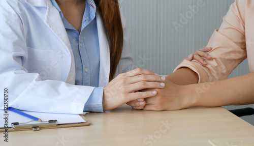 Woman doctor holding hands patient encourage cheer up consultation at hospital medicare treatment clinic. Doctor talking to patient support giving hope listening takecare for mental health therapy photo