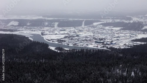 A Panoramic View of Whitehorse's Cityscape Adorned With Winter Scenery in Yukon, Canada - Aerial Drone Shot