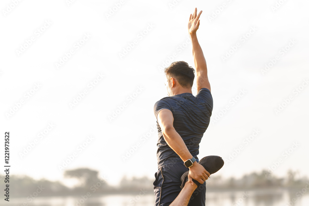 Obraz premium A male athlete enjoys a morning run in the park, smiling and exercising outdoors. Embracing fitness and happiness, he maintains a healthy lifestyle, feeling energized and positive in nature.