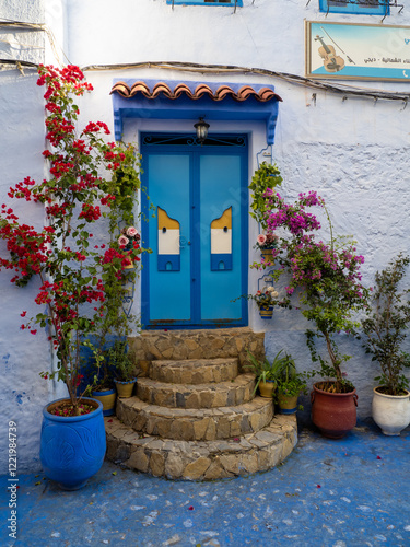 Chefchaouen,  the blue city in Morocco - Doorway and flowers