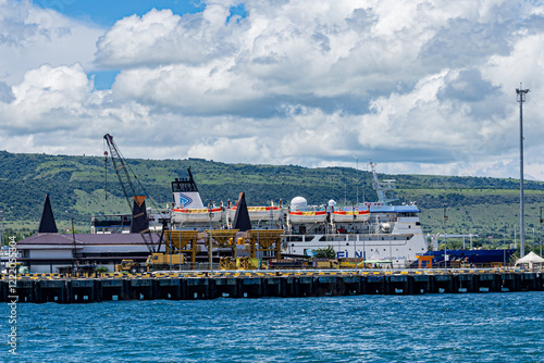 East Sumba, East Nusa Tenggara, Indonesia –  01. 27. 2025 – tugboats unloading coal, Pelni ships disembarking and embarking passengers, and fishing boats anchoring to avoid strong winds
