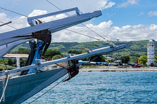 East Sumba, East Nusa Tenggara, Indonesia –  01. 27. 2025 – tugboats unloading coal, Pelni ships disembarking and embarking passengers, and fishing boats anchoring to avoid strong winds