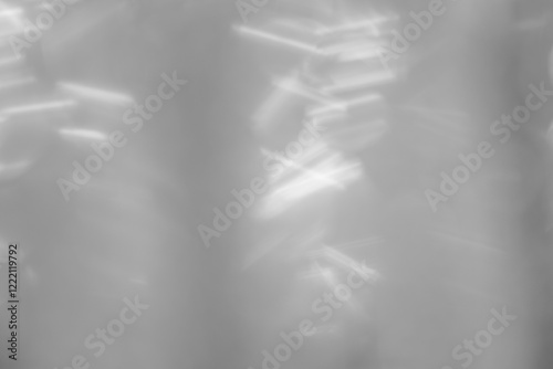 Gray wrinkled plastic wrap. Close-up of grey shiny vinyl wave texture background.
