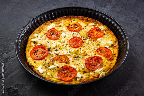 Crustless vegetarian pie with eggs, tomato, basil and cheese, quiche or omelet in a pan photo