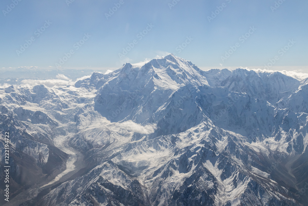 Obraz premium Mountains views from airplane (Islamabad to Skardu) in Pakistan. Beautiful view of snow capped mountains.