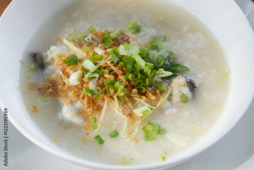 Rice congee with soft-boiled egg flavor with pickled chili vinegar and ground dried chilies Rice congee with soft-boiled egg flavor with pickled chili vinegar and ground dried chilies