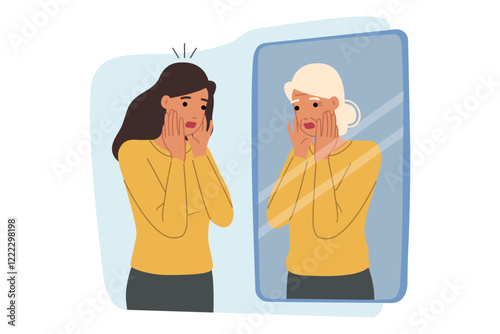 Woman experiences fear of aging, looks in mirror and sees gray hair and wrinkles on face. Psychological trauma causes fear of aging in girl who needs help of psychotherapist or antidepressants