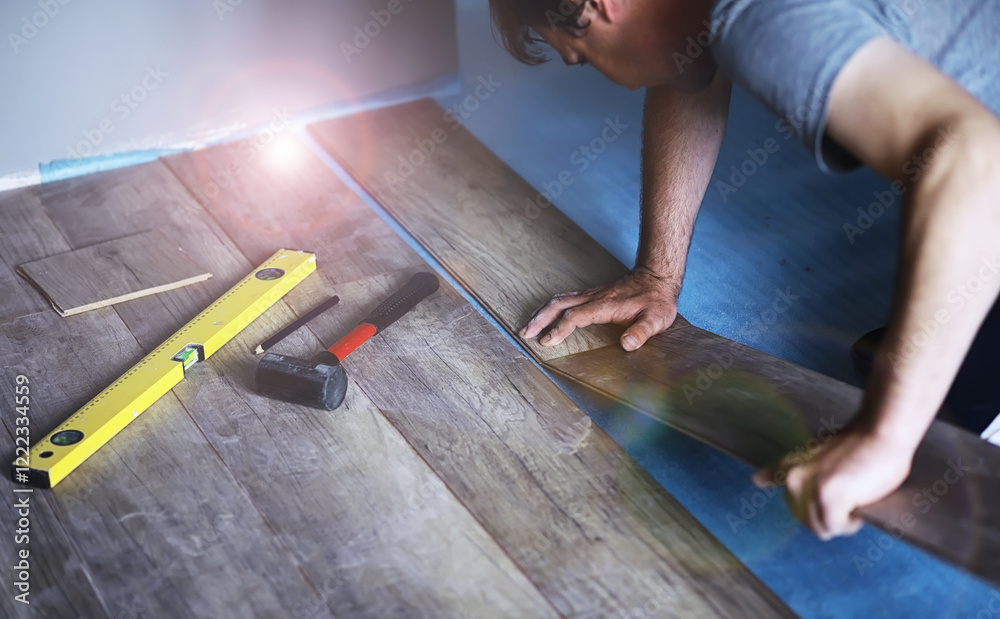 Longitudinal lock joint - The sequence of technological methods for laying and installation of floating flooring - laminate - professional work - selective focus Longitudinal lock joint - The sequence of technological methods for laying and installation of floating flooring - laminate - professional work - selective focus