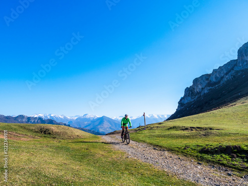 Spain, Asturia, Collada de Pelugano, senior man on e-bike photo