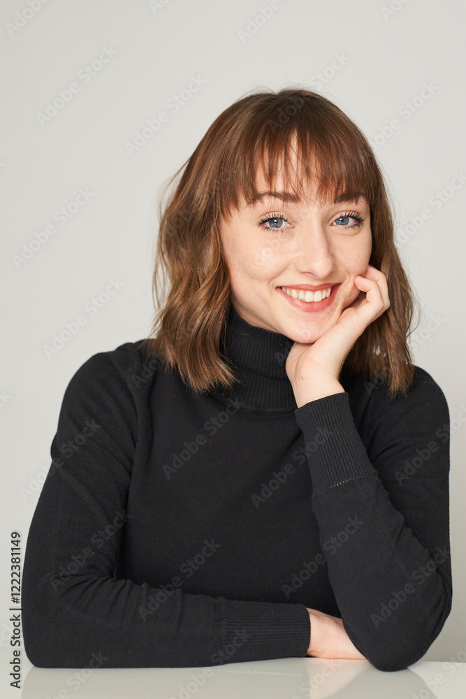 Portrait of smiling young woman wearing black turtleneck pullover Portrait of smiling young woman wearing black turtleneck pullover