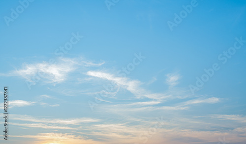 Canvas Print the sky is clear with fiuffy wthite clouds and beautiful orange light