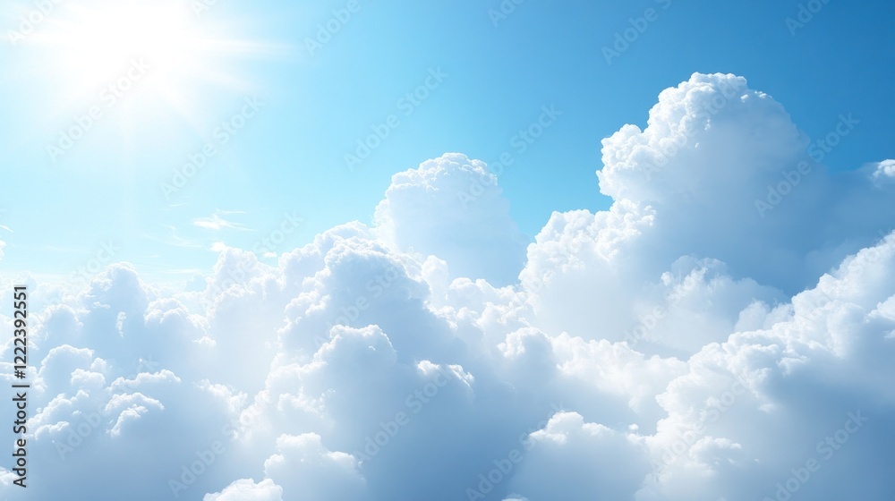 Fototapeta premium Soft, fluffy clouds float in a clear sky under bright sunlight creating a tranquil atmosphere