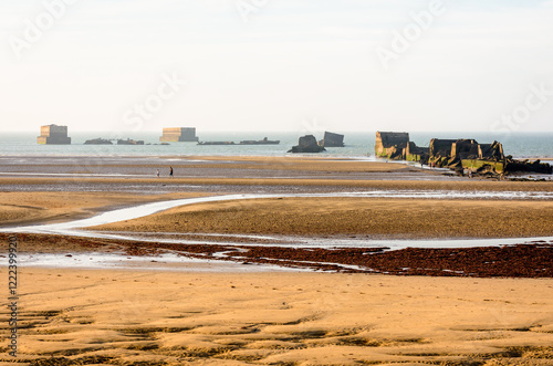 Remains of Phoenix caissons in Asnelles, France, used to build the artificial Mulberry harbour on Gold Beach after the Normandy landings in World War II. photo