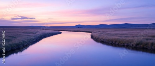 Under a pastel sky, a tranquil river reflects the dawn, evoking peace and the gentle awakening of nature's day.
