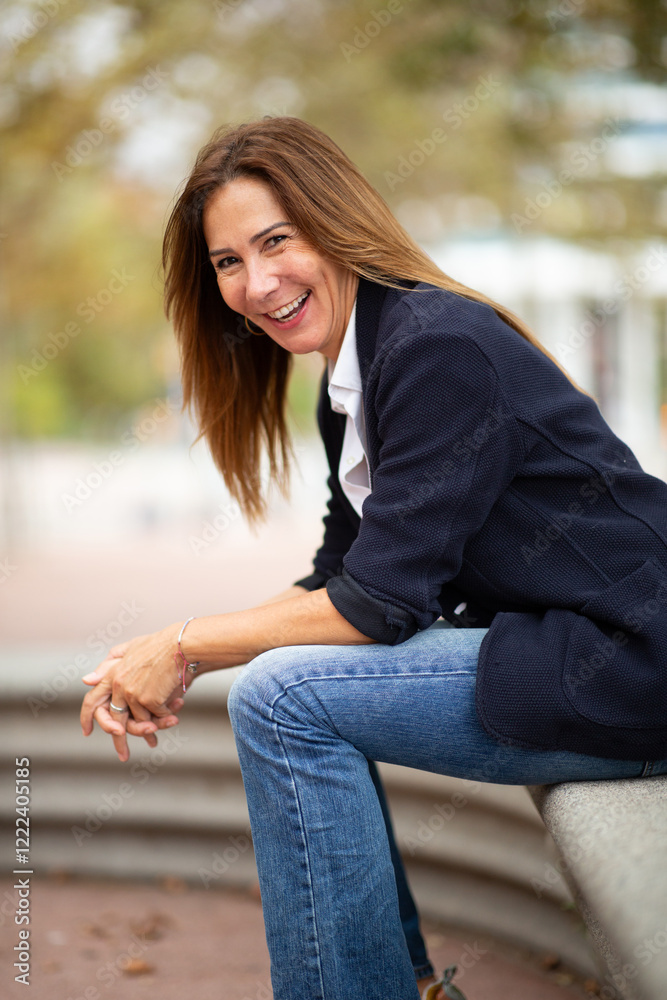 lively and candid portrait of a woman sitting on a bench outdoors lively and candid portrait of a woman sitting on a bench outdoors
