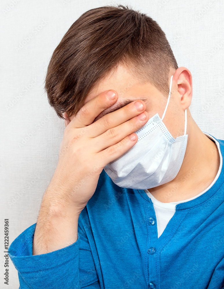 Sad Young Man in Flu Mask
