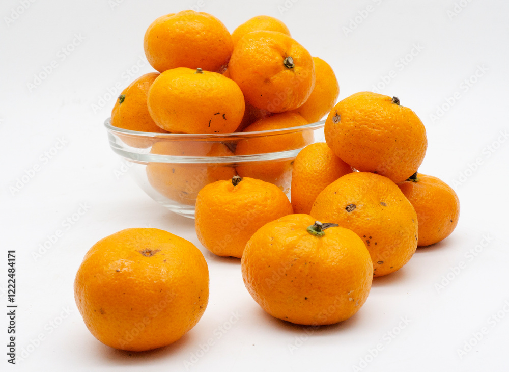 Tangerines. Close view on Fresh Mandarin Orange. Isolated on White Background. Citrus. Sweet. Juicy. Chinese. New Year. Jeruk Keprok Tangerines. Close view on Fresh Mandarin Orange. Isolated on White Background. Citrus. Sweet. Juicy. Chinese. New Year. Jeruk Keprok