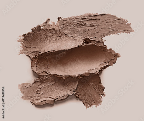 Lipstick samples in mocha mousse shade on beige background, top view. Trendy color of 2025 year photo