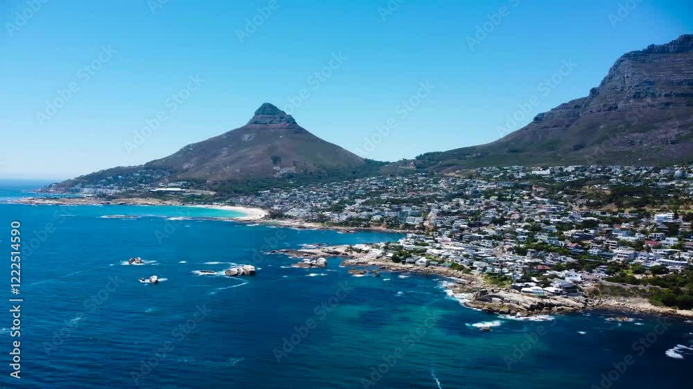 Aerial Video 4K of Camps Bay Cape Town Coastline rocky coastline camera panning left to right with Lion's Head in the background. Aerial Video 4K of Camps Bay Cape Town Coastline rocky coastline camera panning left to right with Lion's Head in the background.