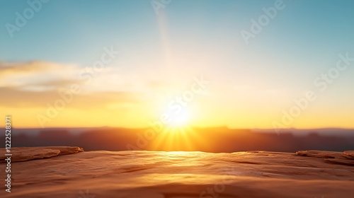 Serene Sunrise Over Rocky Landscape with Clear Blue Sky