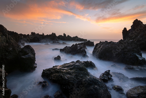 Wallpaper Mural Scenic sunset view of rocky seashore with waves and misty water Torontodigital.ca