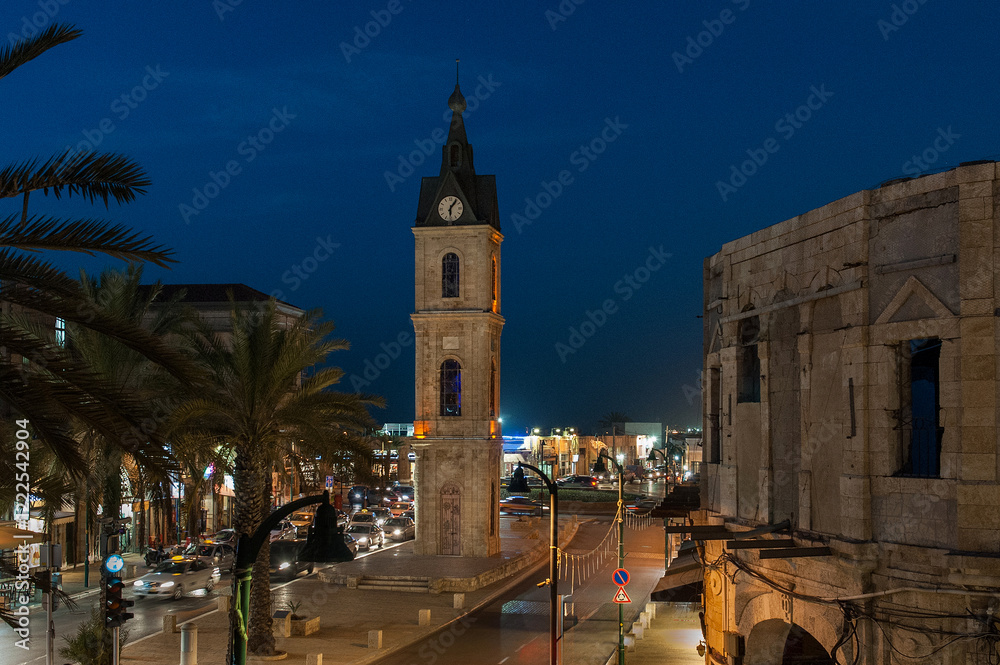 Obraz premium The historic Jaffa Clock Tower in the Old City of Tel Aviv-Yafo, Israel during the twilight blue hour.
