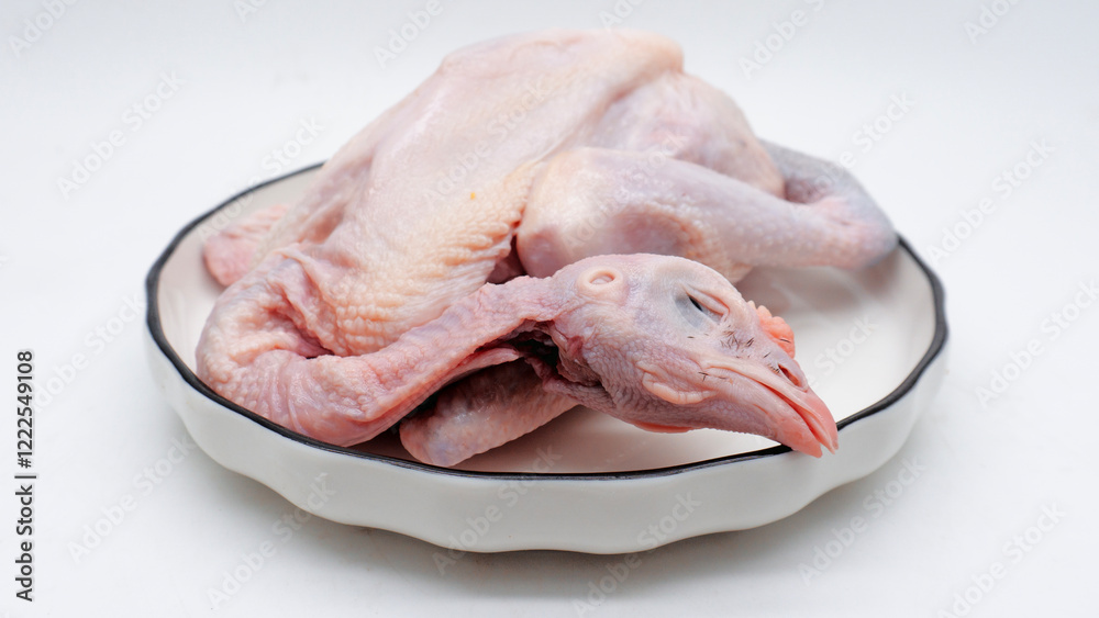 Raw carcass chicken, ayam kampung in Indonesia isolated on white Raw carcass chicken, ayam kampung in Indonesia isolated on white