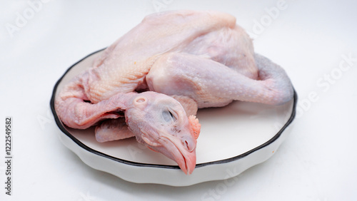 Quadro su tela Raw carcass chicken, ayam kampung in Indonesia isolated on white
