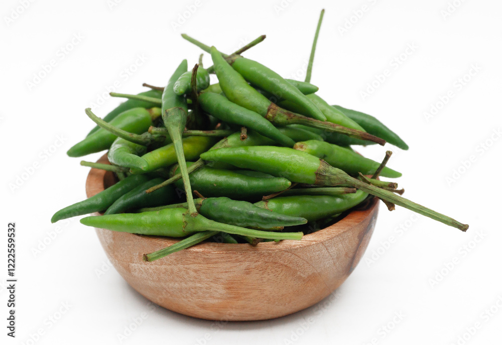 A pile of rawit hijau or green Cayenne pepper (Capsicum frutescens) isolated on white background
A pile of rawit hijau or green Cayenne pepper (Capsicum frutescens) isolated on white background