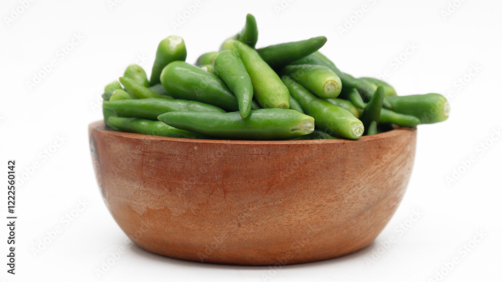 A pile of rawit hijau or green Cayenne pepper (Capsicum frutescens) isolated on white background
A pile of rawit hijau or green Cayenne pepper (Capsicum frutescens) isolated on white background