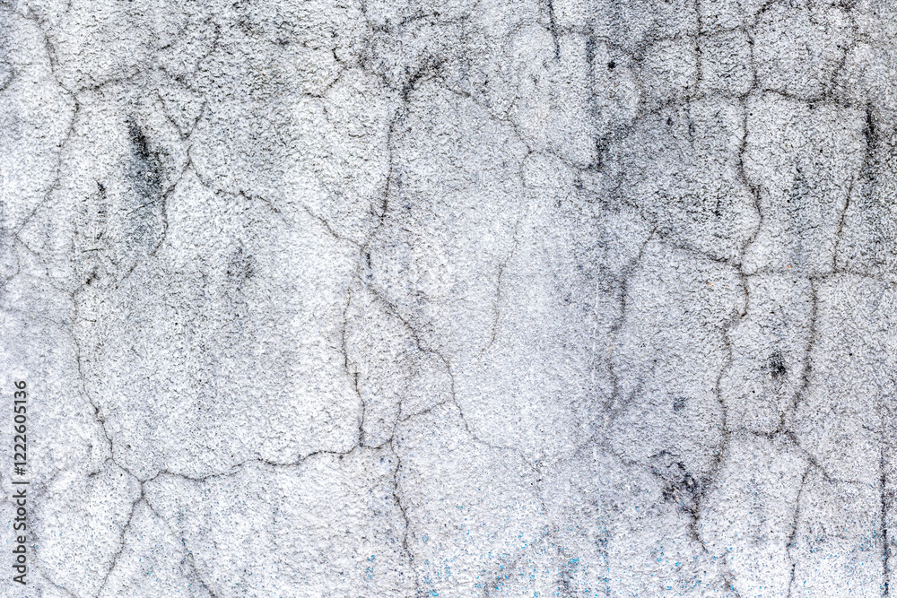 Obraz premium Weathered cracked concrete surface texture with gray tones