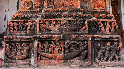 Terracotta carvings depicting boats carrying an army and a king on Rajrajeshwar Temple, Dwarhatta, Hooghly, West Bengal, India. photo