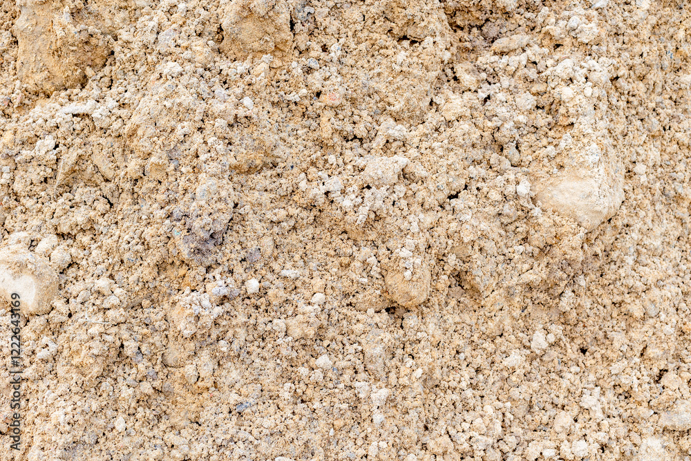Close-up of sandy soil texture with pebbles Close-up of sandy soil texture with pebbles