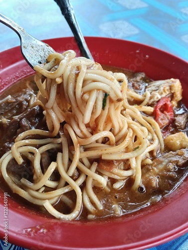 Mi rebus is a noodle dish that is popular in Indonesia , Malaysia and Singapore. It originated in Johor and was created by the Johor Malays. 