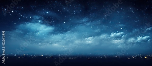 Panoramic view of a deep blue night sky filled with sparkling stars and wispy clouds, with a soft grain effect enhancing the serene atmosphere. photo