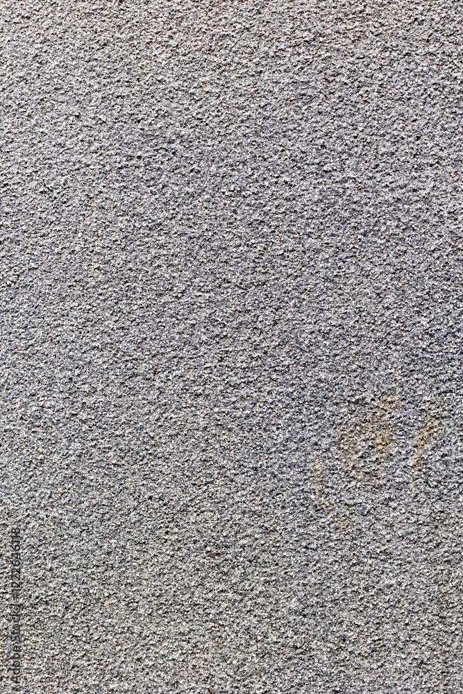 Close-up of textured gray concrete surface showing rough details Close-up of textured gray concrete surface showing rough details
