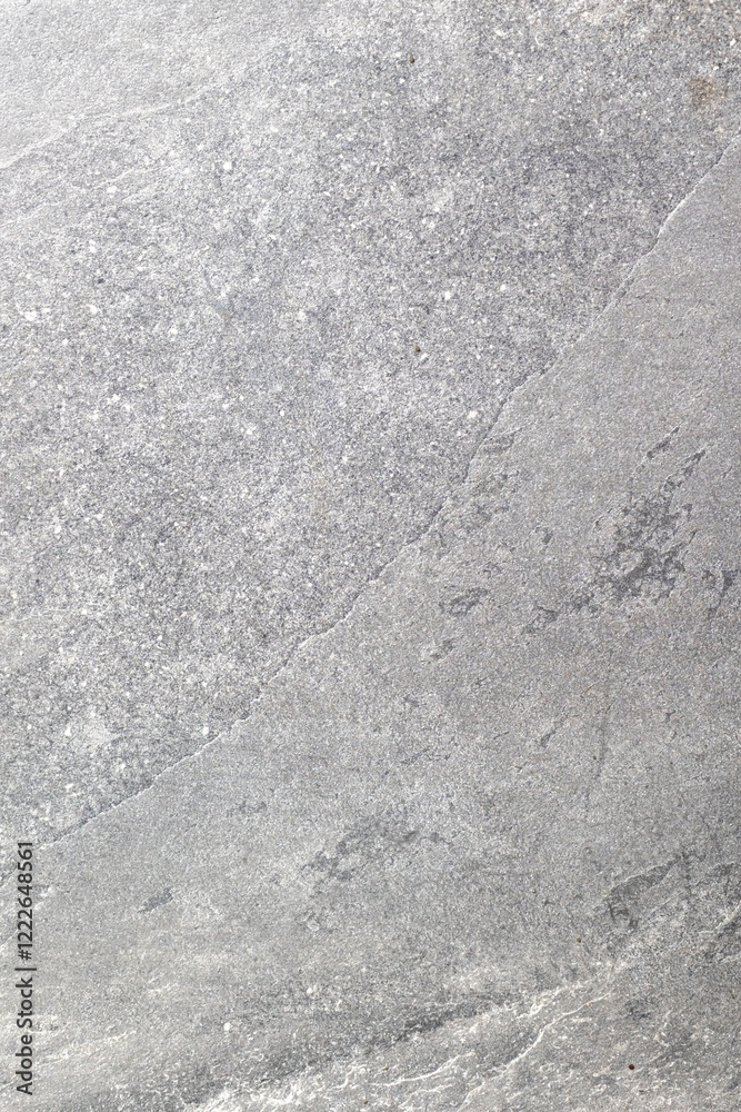 Obraz premium Close-up of gray stone texture with natural patterns and fine details