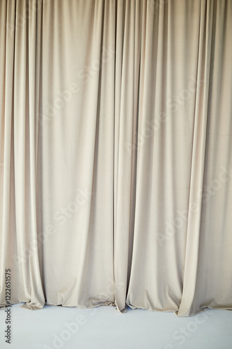 Beautiful curtain or curtain drapery. Natural soft light. Sandy, nude, cream color