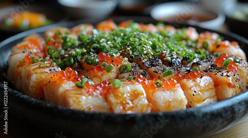 A close-up image of a beautifully arranged sushi platter featuring several pieces of nigiri sushi.