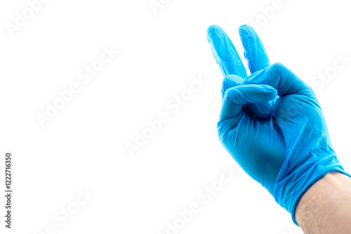 A blue gloved hand holds up two fingers isolated on white background