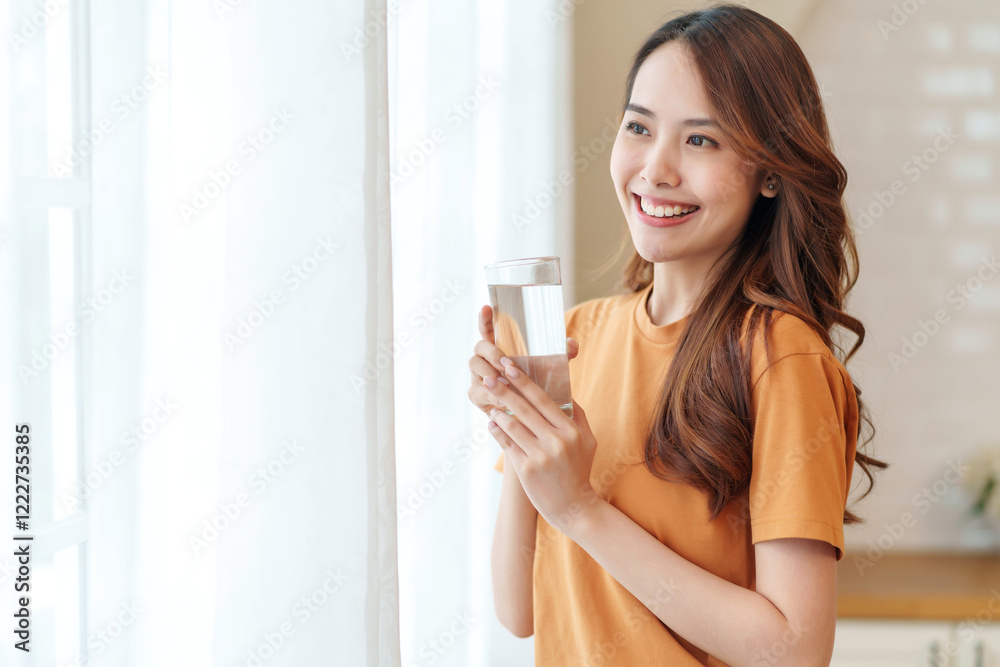 portrait smiling young woman with a glass of fresh water relaxing in the room,people with healthy lifestyle,health,beauty,health care portrait smiling young woman with a glass of fresh water relaxing in the room,people with healthy lifestyle,health,beauty,health care