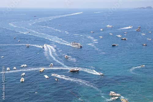 Fototapeta Naklejka Na Ścianę i Meble -  Aerial view of the sea with many boats leaving a white trail
