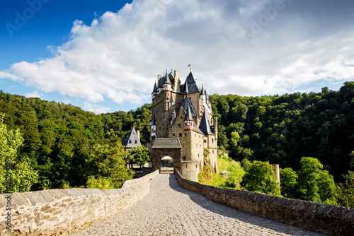 Eltz Castle, a medieval castle located in Germany, Rheinland Pfalz, Mosel region. Beautiful old castle, famous tourist attraction on sunny summer day, empty, without people, nobody. photo