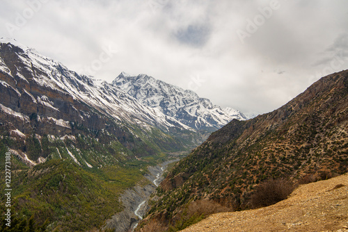 View of Annapurna III, Gangapurna, Tilicho mountains and Marsyangdi river in Himalayas, Annapurna Conservation Area, Nepal. Snow capped landscape. Annapurna Circuit Trek. Hiking trekking concept.  photo