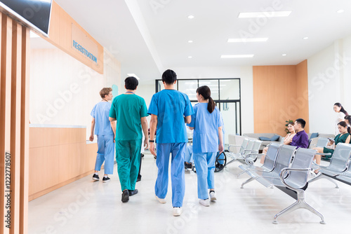Medical staff and patients in a busy hospital reception services at information desk, atmosphere many patients wait for healthcare specialists in hospital. medical team doctors walking pass lobby