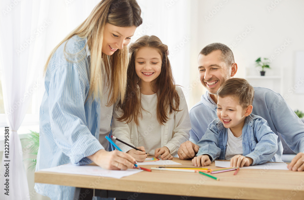 Happy smiling children sitting at the desk with parents in living room at home and drawing a picture with colorful pencils. Kids brother and sister painting in album enjoying time with family. Happy smiling children sitting at the desk with parents in living room at home and drawing a picture with colorful pencils. Kids brother and sister painting in album enjoying time with family.