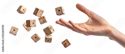 A hand is tossing dice into the air, showcasing a playful moment.