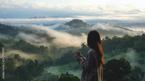 Wallpaper Mural Blurred rear view of a woman looking at a beautiful foggy mountain and nature view Torontodigital.ca