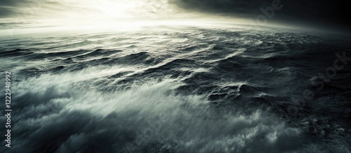 Aerial view of dramatic ocean waves showcasing expansive water surface with dark tones and ample copyspace for text or branding use.
