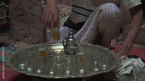 Mint tea ceremony in Morocco and Arab country with teapot and silver tray